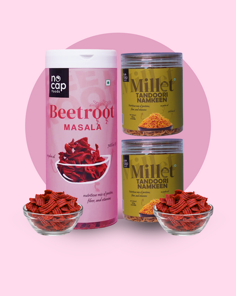 Two containers of beetroot masala and millet tandoori namkeen on a pink background