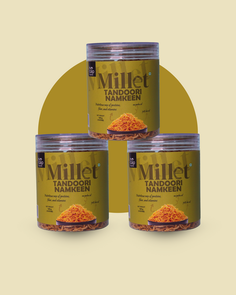 Three jars of Millet Tandoori Namkeen on a beige background